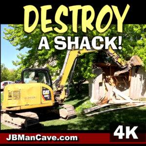 Excavator Demolishes Shack excavator